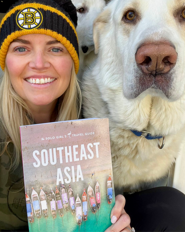 reader with her southeast asia travel guide copy