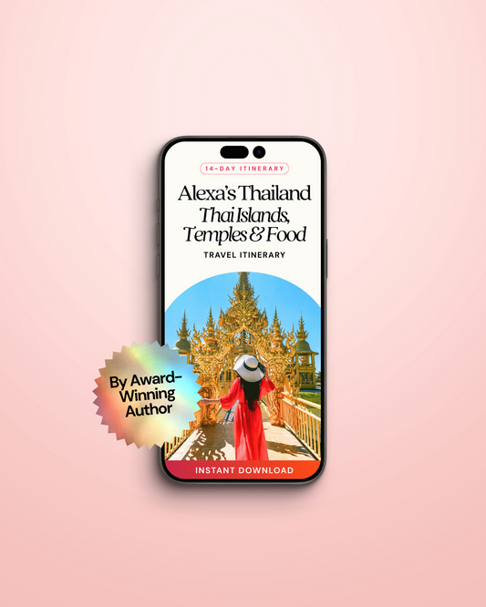 Phone displaying a Thailand travel itinerary app with a pink background