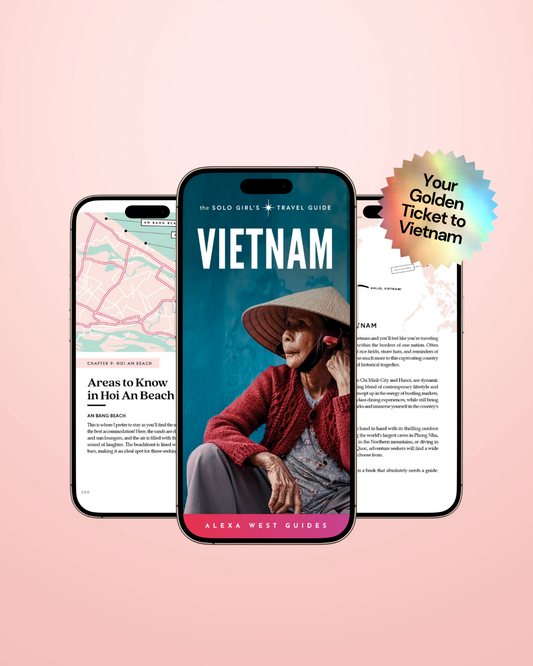 Phone displaying a Vietnam travel guide app with a woman in a hat and text on a pink background
